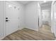 Clean entryway with hardwood floors leading to other rooms in the house at 11218 Sun Tree Rd, Hudson, FL 34667