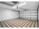 Clean and spacious garage with ample room for parking and storage, featuring patterned flooring at 11218 Sun Tree Rd, Hudson, FL 34667
