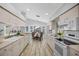 Bright kitchen with white appliances, ample counter space, and charming breakfast nook with bay windows at 11218 Sun Tree Rd, Hudson, FL 34667