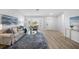 Bright living room with hardwood floors, neutral decor, and a bay window at 11218 Sun Tree Rd, Hudson, FL 34667