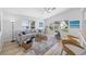 Bright living room featuring vaulted ceilings, plenty of light, and stylish furniture at 11218 Sun Tree Rd, Hudson, FL 34667