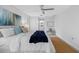 Well-lit bedroom with a ceiling fan, a cozy sitting bench, and tasteful decor at 11218 Sun Tree Rd, Hudson, FL 34667