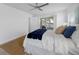 Comfortable bedroom with sliding door access to the patio, wood-look floors, and neutral decor at 11218 Sun Tree Rd, Hudson, FL 34667