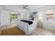 Inviting main bedroom with access to a screened patio, complemented by stylish furnishings at 11218 Sun Tree Rd, Hudson, FL 34667