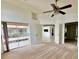Bedroom with balcony access and multiple doorways creating an open and airy layout at 114 Clays Trl # 114, Oldsmar, FL 34677