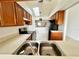 Efficient kitchen with a pass-through window and modern appliances at 114 Clays Trl # 114, Oldsmar, FL 34677