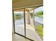 Relaxing screened patio offers serene lake views at 114 Clays Trl # 114, Oldsmar, FL 34677