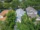 Aerial view showcasing the roof and surrounding trees of the home and neighborhood at 11932 Whisper Creek Dr, Riverview, FL 33569