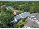 Aerial view of a well-maintained home surrounded by lush greenery and mature trees at 11932 Whisper Creek Dr, Riverview, FL 33569