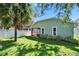 Charming backyard featuring a screened lanai, privacy fence, and manicured landscaping at 11932 Whisper Creek Dr, Riverview, FL 33569