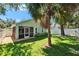 Well-maintained backyard featuring a screened in patio with a privacy fence at 11932 Whisper Creek Dr, Riverview, FL 33569