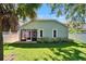 Manicured backyard featuring a screened lanai and lush landscaping, perfect for outdoor enjoyment at 11932 Whisper Creek Dr, Riverview, FL 33569