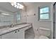 Bathroom featuring granite countertops and a tiled shower at 11932 Whisper Creek Dr, Riverview, FL 33569