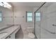 Bathroom showcasing granite countertops, a glass shower and tiled flooring at 11932 Whisper Creek Dr, Riverview, FL 33569