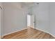 Bedroom features wood flooring and a door to another room at 11932 Whisper Creek Dr, Riverview, FL 33569
