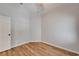 Bright bedroom with hardwood floors, ceiling fan, neutral walls and white trim at 11932 Whisper Creek Dr, Riverview, FL 33569