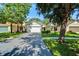 Beautiful home with attached two-car garage, mature landscaping, and a well-maintained lawn at 11932 Whisper Creek Dr, Riverview, FL 33569