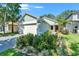 Charming single-story home featuring a well-manicured lawn and an attached two-car garage at 11932 Whisper Creek Dr, Riverview, FL 33569