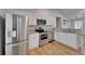Bright kitchen featuring stainless steel appliances, granite countertops and white cabinets at 11932 Whisper Creek Dr, Riverview, FL 33569