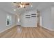 Bright living room with wood floors, ceiling fan, and stylish decor at 11932 Whisper Creek Dr, Riverview, FL 33569