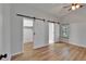 Primary bedroom featuring barn doors leading to closet and ensuite bathroom at 11932 Whisper Creek Dr, Riverview, FL 33569