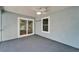 Screened patio with ceiling fan, window, and sliding glass door to the indoors at 11932 Whisper Creek Dr, Riverview, FL 33569