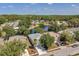 This aerial shot shows the house, a lake, and the surrounding neighborhood at 12351 Ridgedale Dr, Hudson, FL 34669
