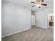This bedroom features tile floors and an ensuite bathroom at 12351 Ridgedale Dr, Hudson, FL 34669