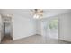 Bedroom with sliding glass doors providing backyard views at 12351 Ridgedale Dr, Hudson, FL 34669
