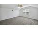 Large main bedroom with vaulted ceiling, blinds on windows, and wood-look tile flooring at 12351 Ridgedale Dr, Hudson, FL 34669