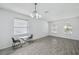 Bright dining area with modern flooring, chandelier, and ample natural light at 12351 Ridgedale Dr, Hudson, FL 34669