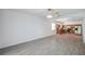 Open-concept space with tile flooring, abundant natural light, and kitchen views at 12351 Ridgedale Dr, Hudson, FL 34669