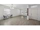 Spacious living area with modern tile flooring and a view of the entryway at 12351 Ridgedale Dr, Hudson, FL 34669