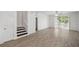 Spacious living room with tile flooring and sliding glass doors to the backyard at 12351 Ridgedale Dr, Hudson, FL 34669