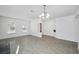 Open-concept living and dining area featuring contemporary flooring and natural light at 12351 Ridgedale Dr, Hudson, FL 34669