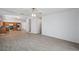 Open-concept space with tile flooring, abundant natural light, and kitchen views at 12351 Ridgedale Dr, Hudson, FL 34669