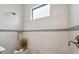 Tiled shower with a built-in niche and a small window that allows for natural light at 17537 Brighton Lake Rd, Land O Lakes, FL 34638