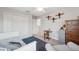 Bedroom with airplane decor, daybed, and adjacent seating area at 17537 Brighton Lake Rd, Land O Lakes, FL 34638