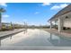 Relaxing community pool with lounge chairs, pavilion, and lush landscaping, perfect for leisure at 17537 Brighton Lake Rd, Land O Lakes, FL 34638