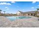 Beautiful community pool with sun loungers, ample space, and a covered outdoor area for relaxation at 17537 Brighton Lake Rd, Land O Lakes, FL 34638