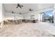 Indoor community space with tables, chairs, ceiling fans, and access to the pool area at 17537 Brighton Lake Rd, Land O Lakes, FL 34638