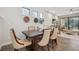 Elegant dining area with dark wood table, comfortable seating, and stylish decor, creating a warm atmosphere at 17537 Brighton Lake Rd, Land O Lakes, FL 34638