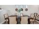 Charming dining space featuring a dark wood table, comfortable seating, and decorative accents creating an inviting atmosphere at 17537 Brighton Lake Rd, Land O Lakes, FL 34638