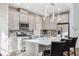 Beautiful kitchen with stainless appliances, white cabinets, stone backsplash and pendant lighting at 17537 Brighton Lake Rd, Land O Lakes, FL 34638