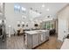 Spacious open-plan kitchen with island, pendant lighting, stainless appliances at 17537 Brighton Lake Rd, Land O Lakes, FL 34638