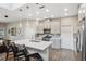 Kitchen with island, breakfast bar, pendant lights, and stainless steel appliances at 17537 Brighton Lake Rd, Land O Lakes, FL 34638