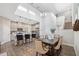 Open concept kitchen with island, pendant lights, stainless appliances, and dining area at 17537 Brighton Lake Rd, Land O Lakes, FL 34638