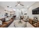 Inviting living room featuring a cozy sofa, stylish furnishings, and an open layout connecting to the modern kitchen at 17537 Brighton Lake Rd, Land O Lakes, FL 34638