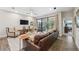 Cozy living room with ceiling fan, sliding glass doors, and stylish furnishings at 17537 Brighton Lake Rd, Land O Lakes, FL 34638