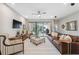 Comfortable living room with ceiling fan, sliding glass doors, and stylish decor at 17537 Brighton Lake Rd, Land O Lakes, FL 34638